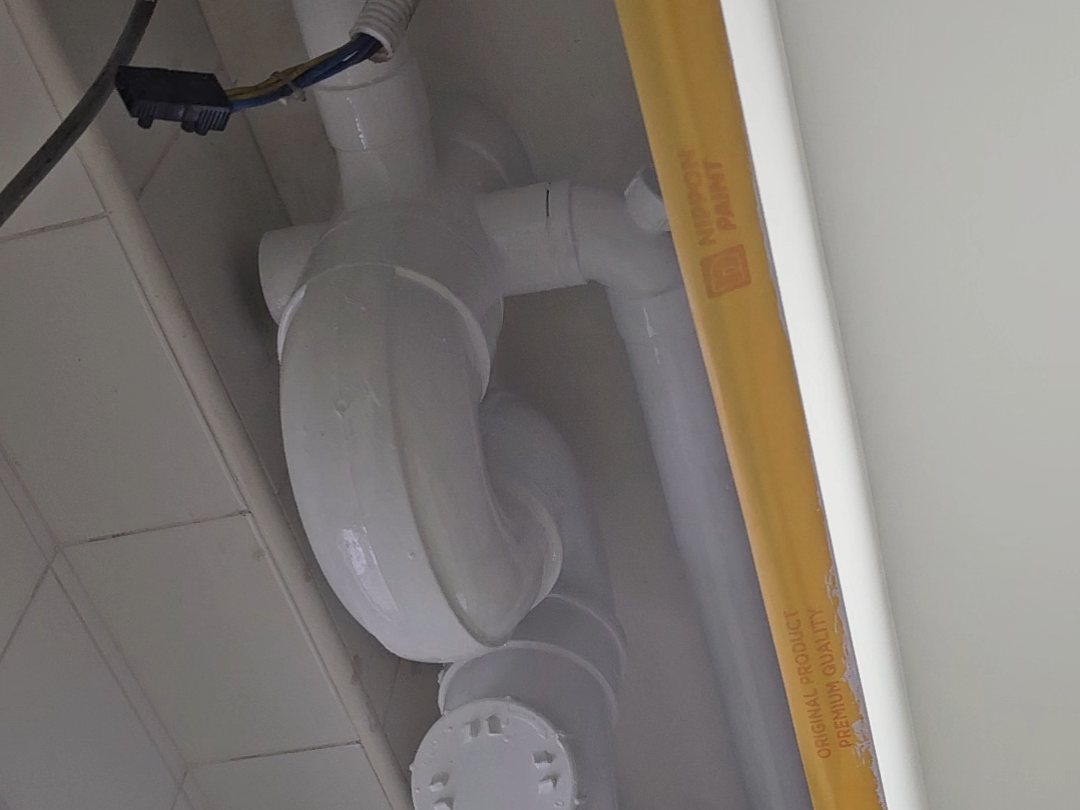 Pipes treated and repainted fresh white, HDB bathroom Singapore